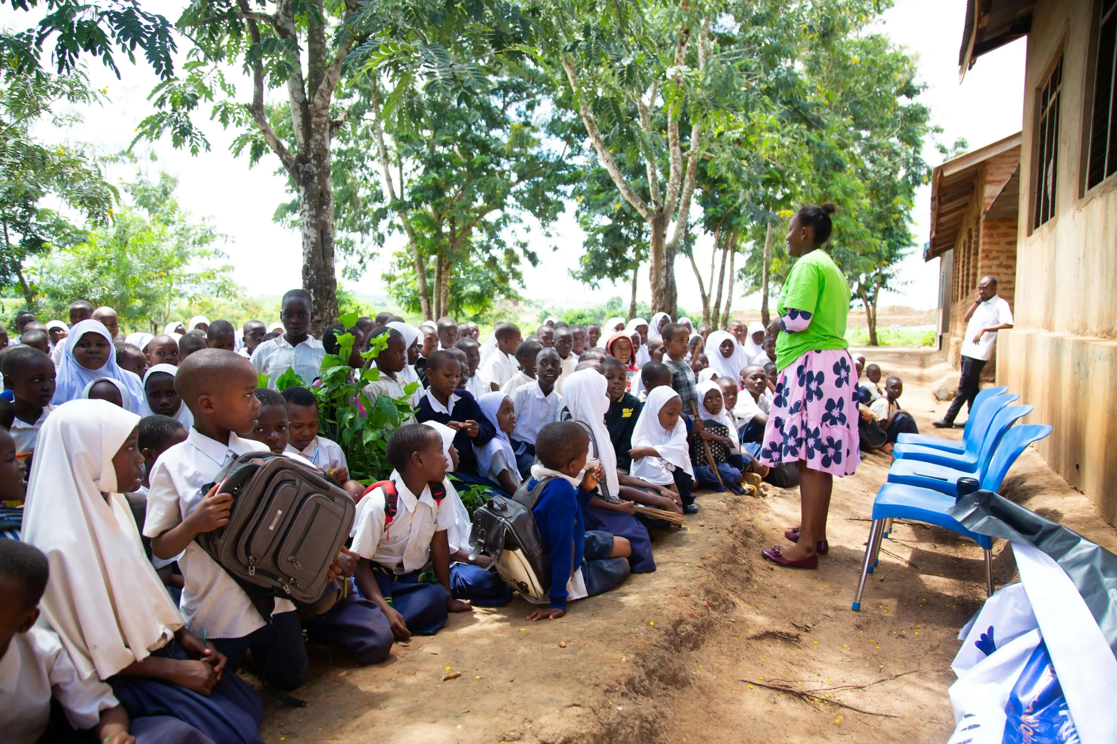 A teacher with students outside